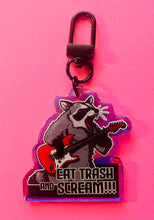 Load image into Gallery viewer, “Eat trash and SCREAM!” Raccoon with guitar Rainbow Holographic Keychain!