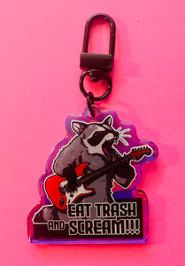 “Eat trash and SCREAM!” Raccoon with guitar Rainbow Holographic Keychain!