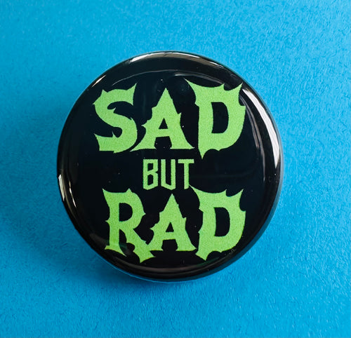 sad but rad green and black button